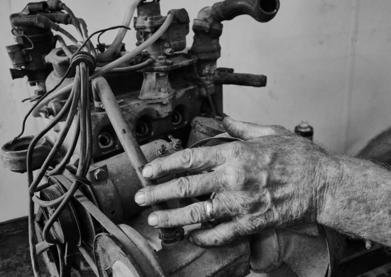 Mechanic repairing a motorcycle engine