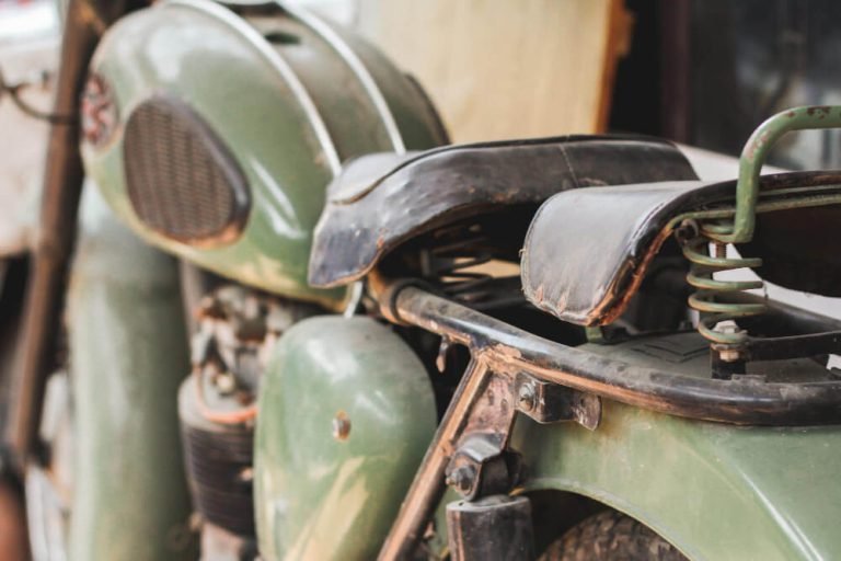 Older motorcycle ready for parts assessment