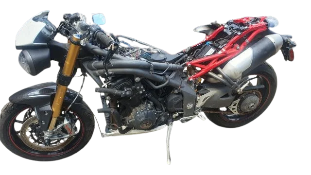 Partly dismantled motorcycles for parts assessment