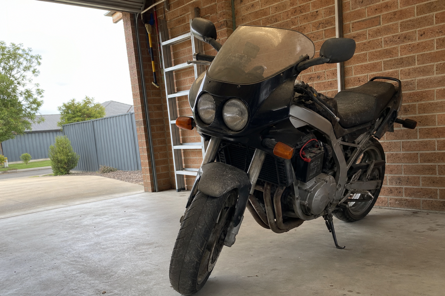 Non-running motorcycle in a Ballarat garage ready for assessment